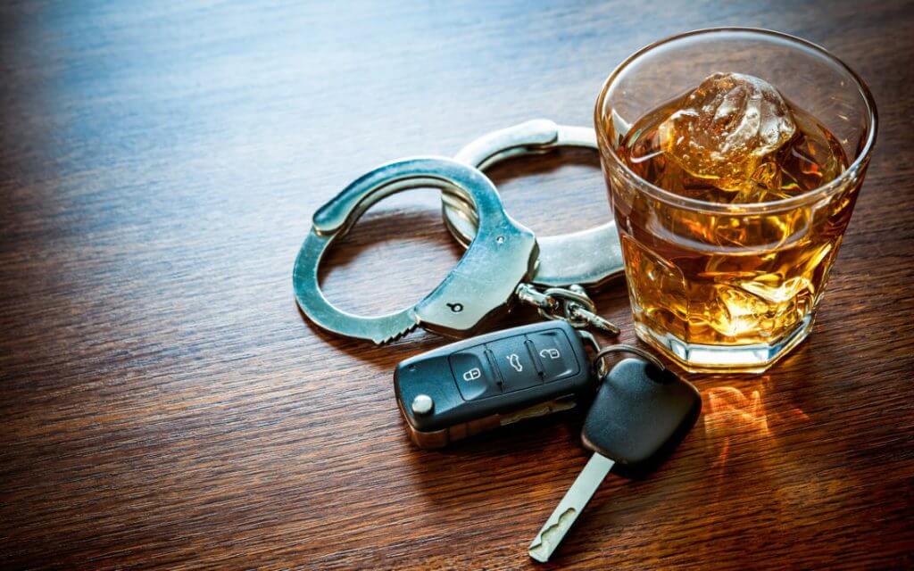 Car keys_ handcuffs_alcohol